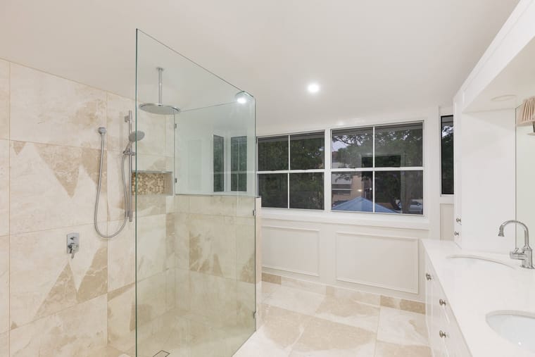 Travertine ensuite with walk-in shower — bathrooms & ensuites in Brisbane by Torrisi Tiling