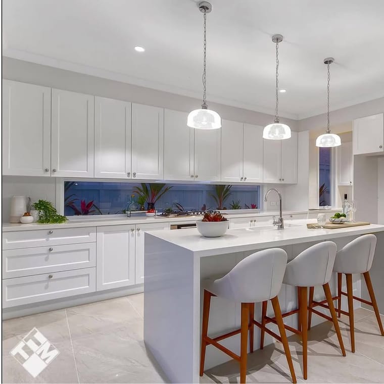 Kitchen island and splashback with pendant lighting — tiling by Torrisi Tiling, Brisbane
