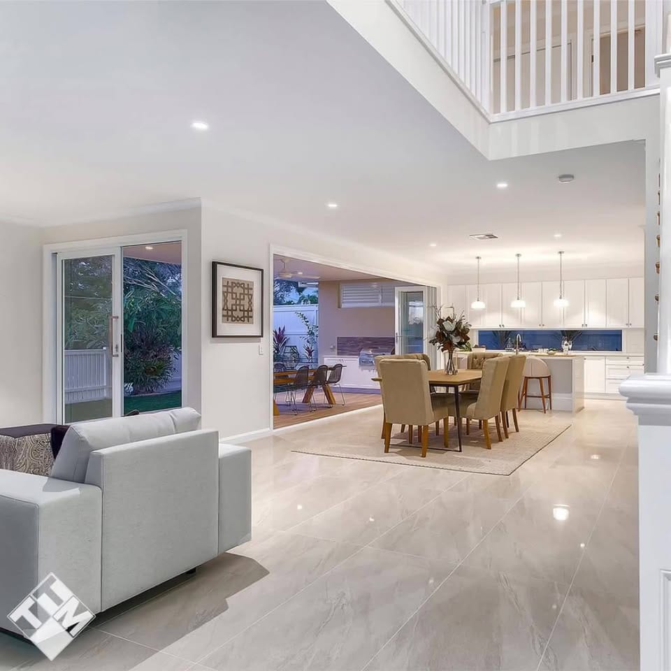 Large-format polished floor through open-plan living — tiling by Torrisi Tiling near Everton Park, Brisbane