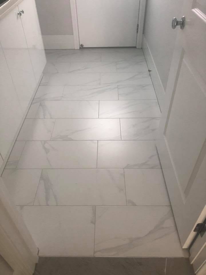 Marble-look floor and shower, frameless glass — silicone & sealing in Brisbane by Torrisi Tiling