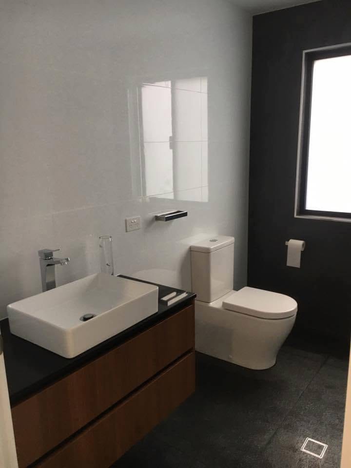 Vessel basin, timber vanity and dark floor tile — tiling by Torrisi Tiling, Brisbane