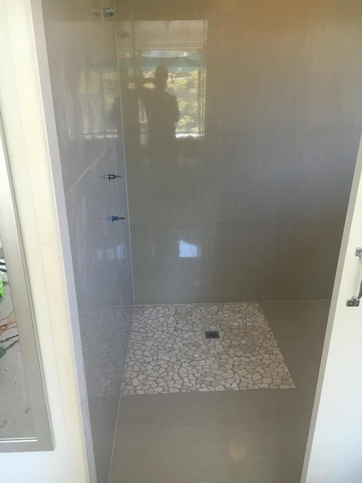 Pebble-base shower with full-height tiling — tiling by Torrisi Tiling, Brisbane