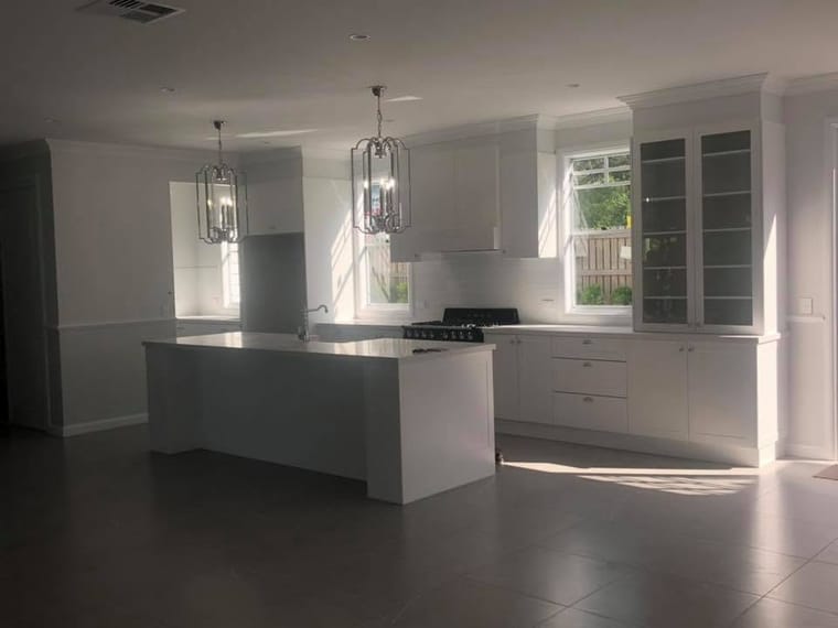 White island kitchen with pendant lights — tiling by Torrisi Tiling, Brisbane