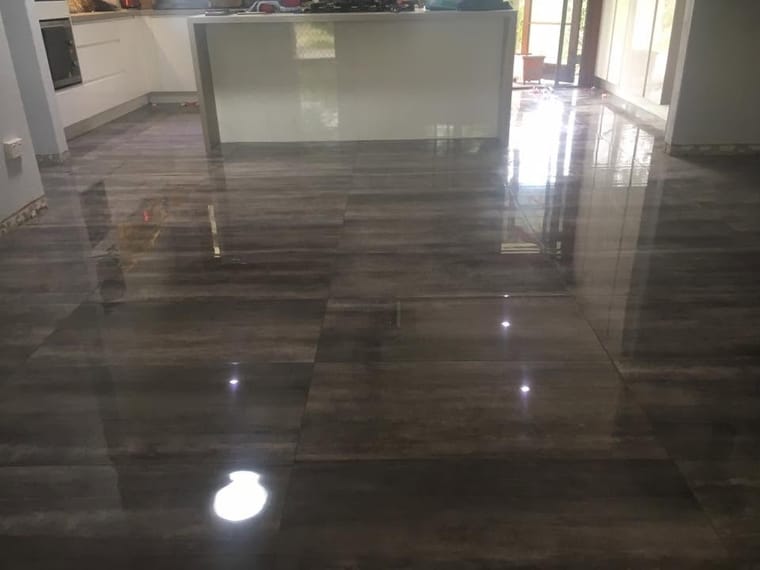 High-gloss floor through open living — wall & floor tiling in Brisbane by Torrisi Tiling