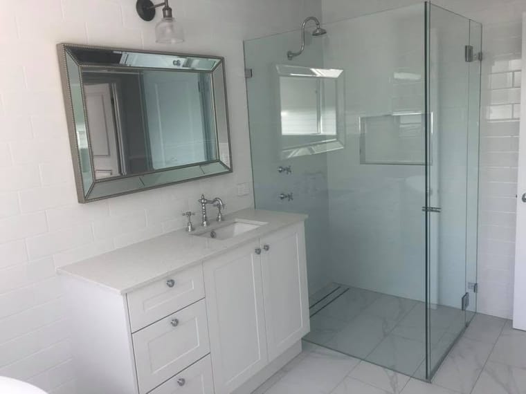 Vanity, mirror and frameless shower — tiling by Torrisi Tiling, Brisbane