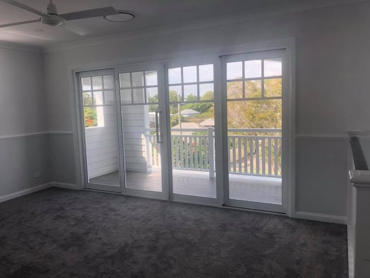Living room floor to French doors — tiling by Torrisi Tiling, Brisbane