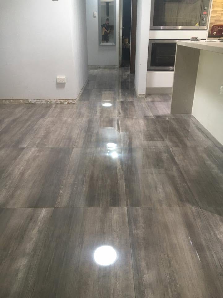 Timber-look plank tile into the kitchen — tiling by Torrisi Tiling, Brisbane