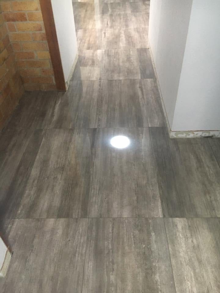 Timber-look plank tile through the hallway — tiling by Torrisi Tiling, Brisbane