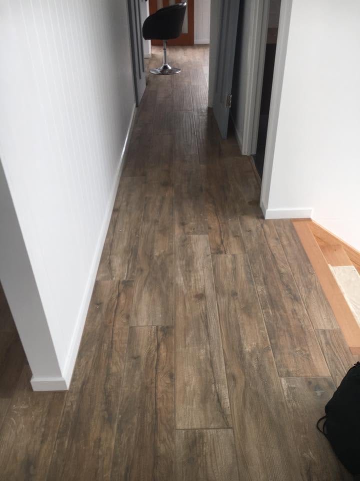Plank tile laid down a hallway — tiling by Torrisi Tiling, Brisbane