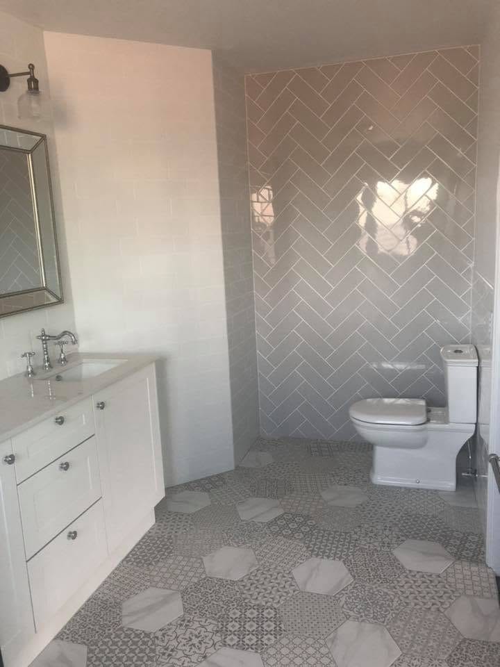 Hexagon patterned floor with white vanity — tiling by Torrisi Tiling, Brisbane