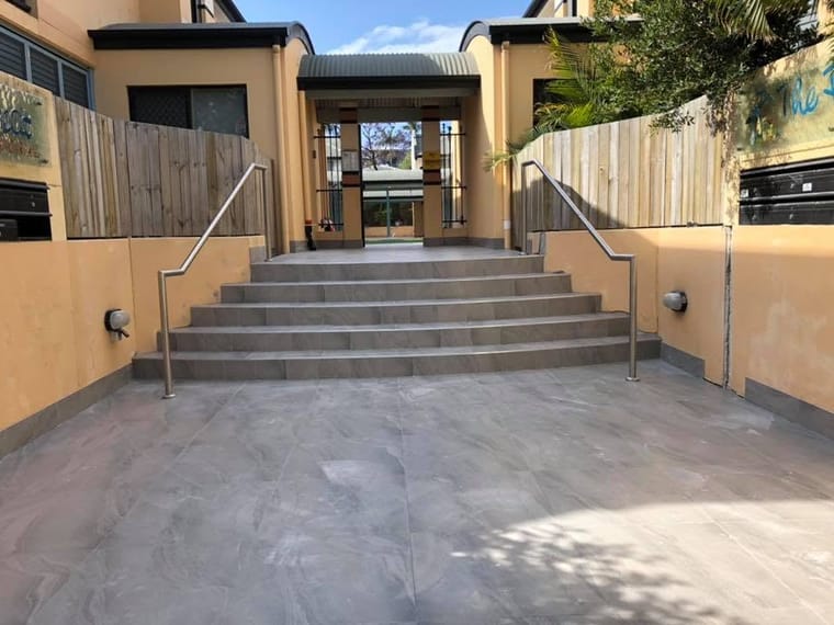 Tiled external stairs with handrail — tiling by Torrisi Tiling, Brisbane