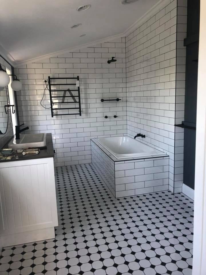 Subway walls over an octagon mosaic floor — tiling by Torrisi Tiling, Brisbane