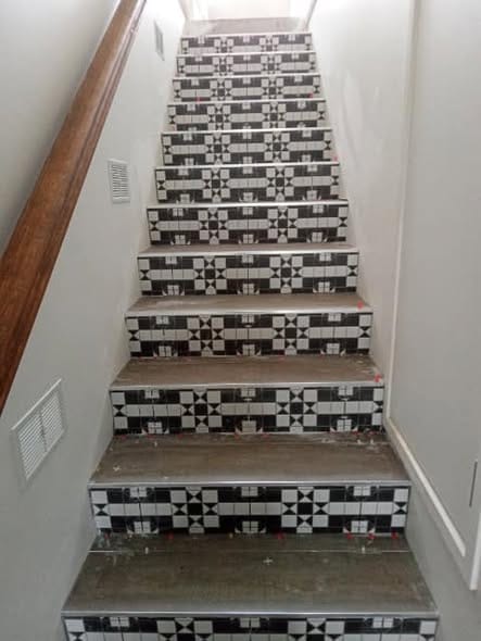Feature riser tiling detail — tiling by Torrisi Tiling, Brisbane